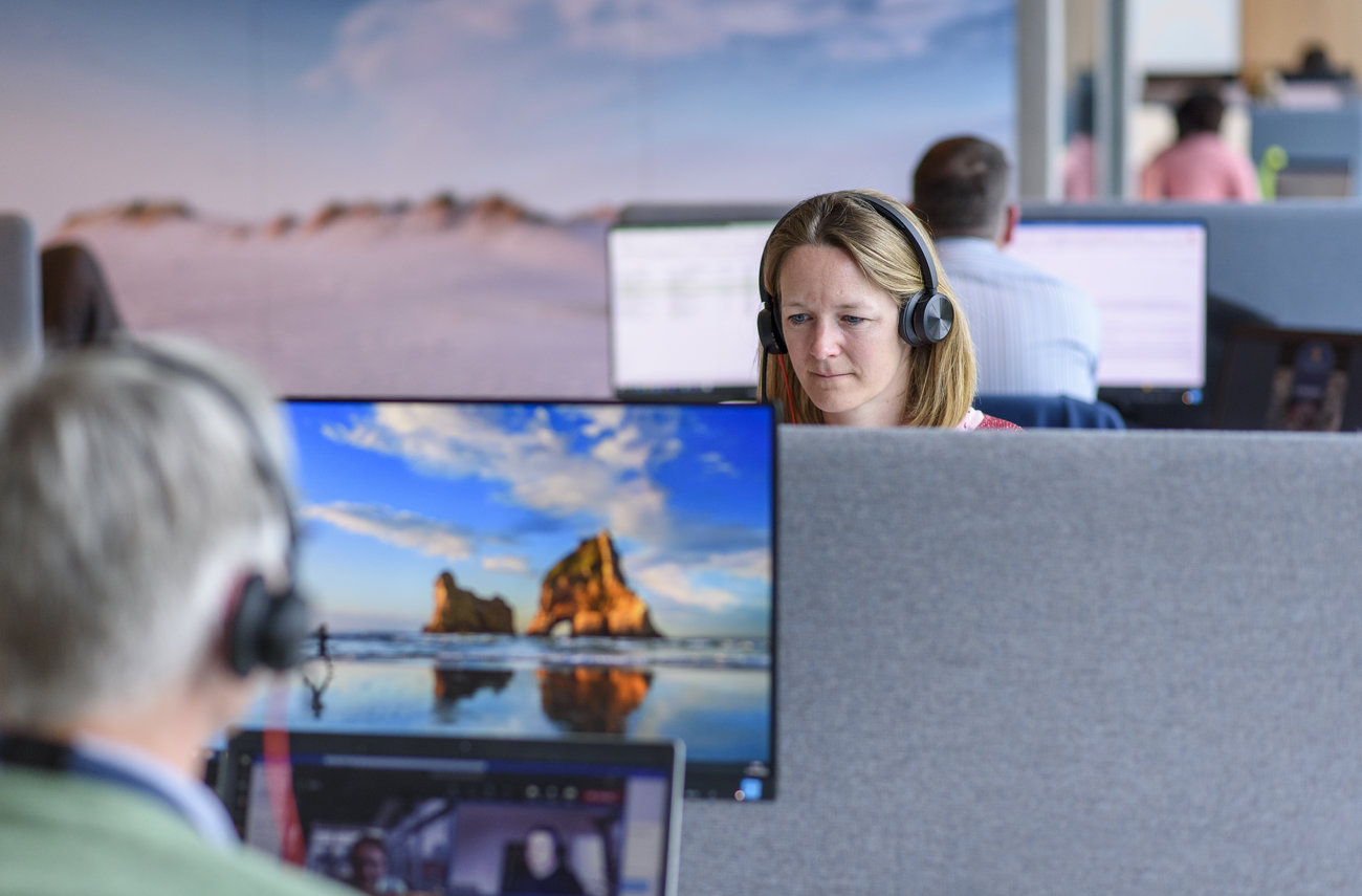 Employees at a desk